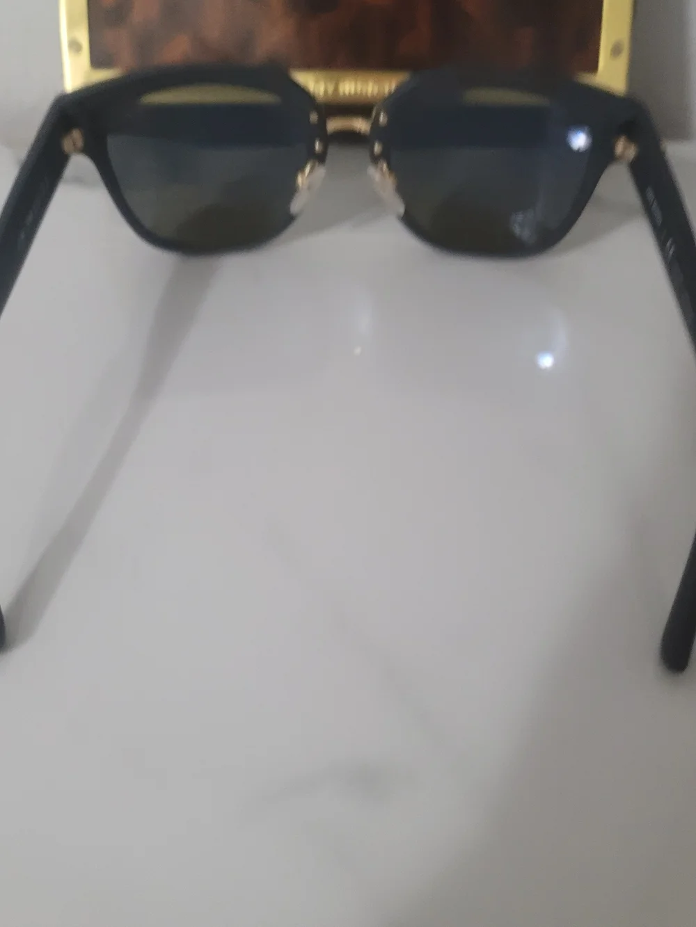 Tory Burch Black Frame Sunglasses with Blue Mirrored Lenses